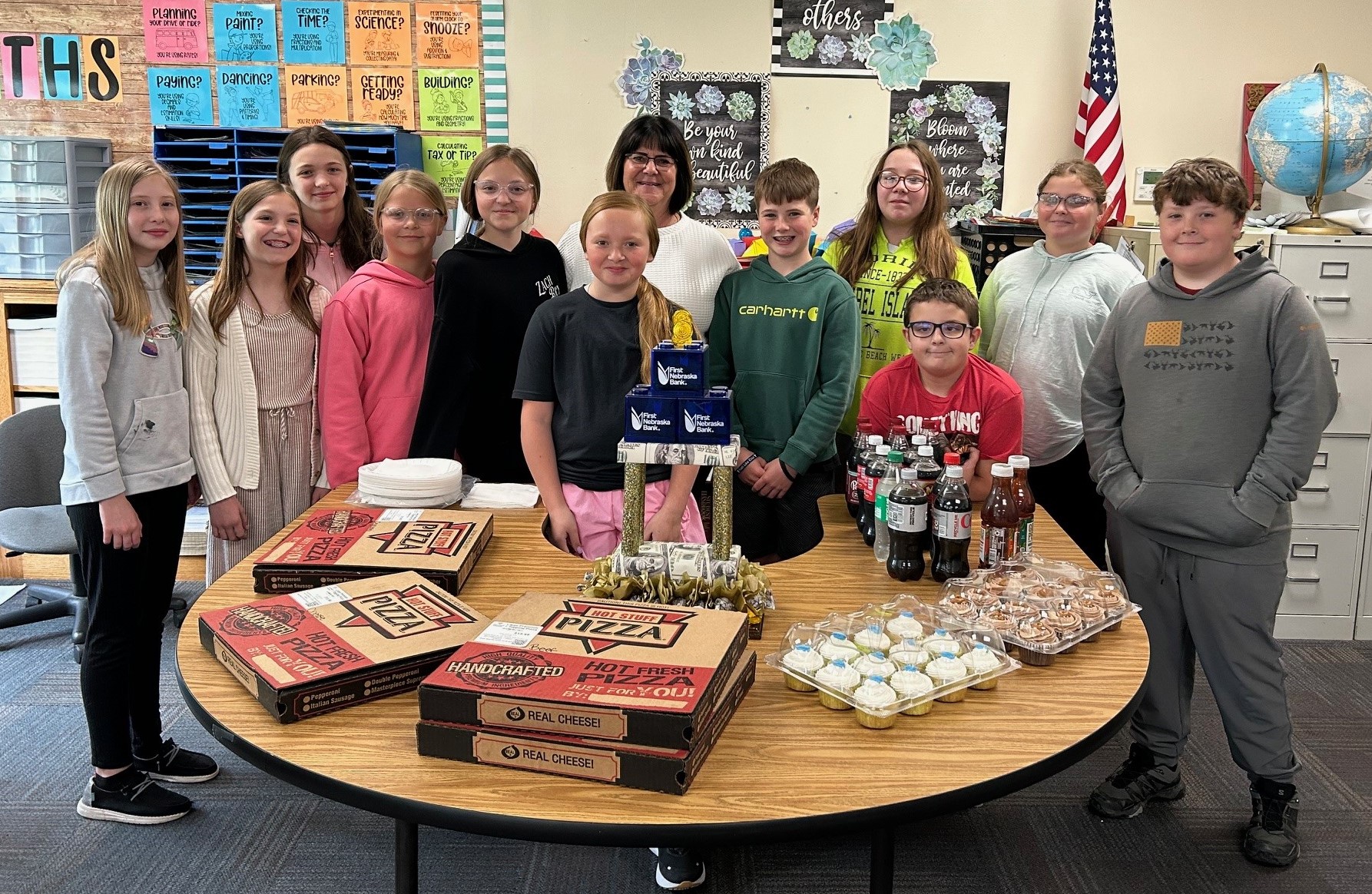 First Nebraska Bank hosted a special awards ceremony and pizza party for the Tribe Branch school savings program to congratulate the students on their great work.